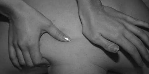 Person massaging another person's back