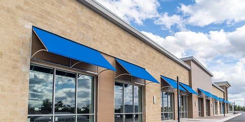 Storefront with blue awnings