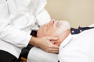 Man Receiving Chiropractic Adjustment Man Receiving Chiropractic Adjustment